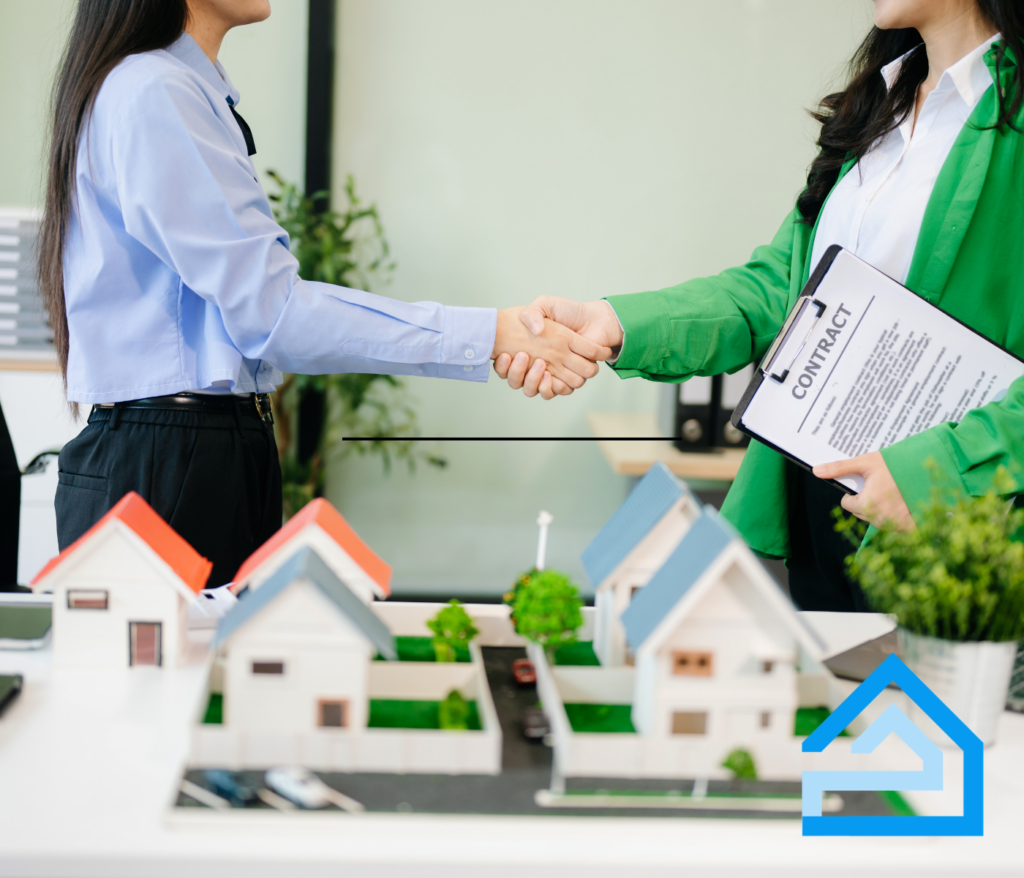 Real estate agent and residential appraiser discussing property value and shaking hands