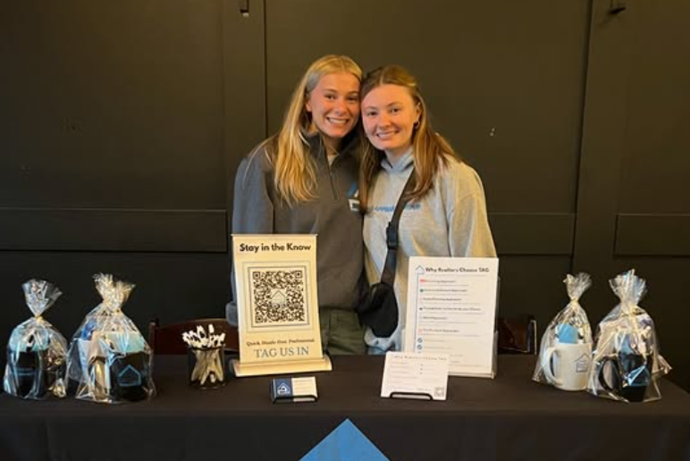 Triangle Appraisal Group at their sponsorship table during Bill Gallagher's Blowout Class in Charlotte through the Superior School of Real Estate